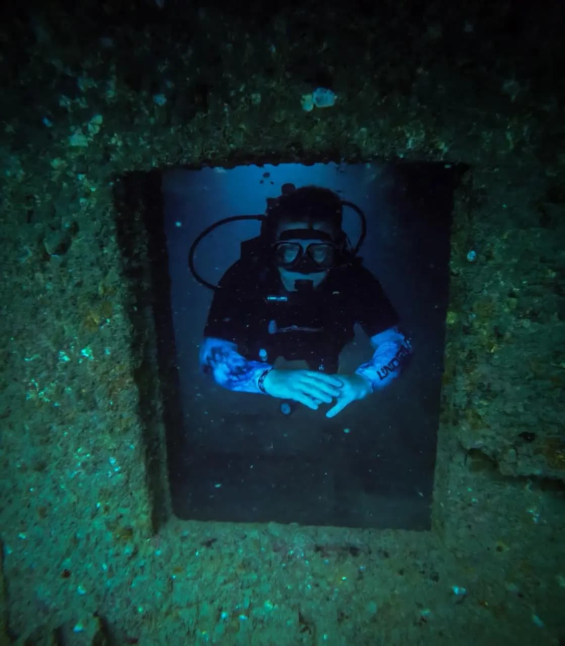 Scuba diver framed in a shipwreck doorway off Trincomalee
