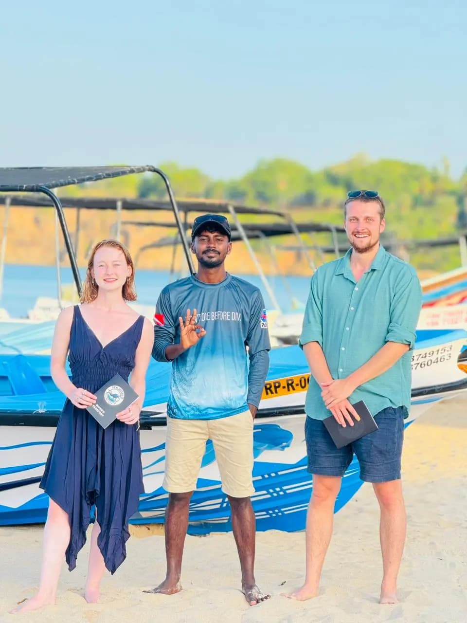 J Rockshan with two newly certified Open Water students on the beach in Trincomalee, Sri Lanka