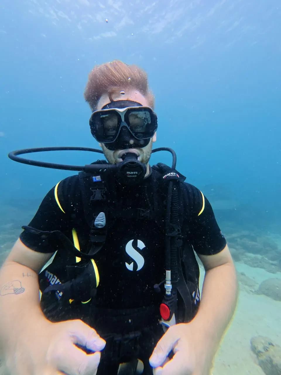 Scuba diver hovering over the sand in Trincomalee, Sri Lanka